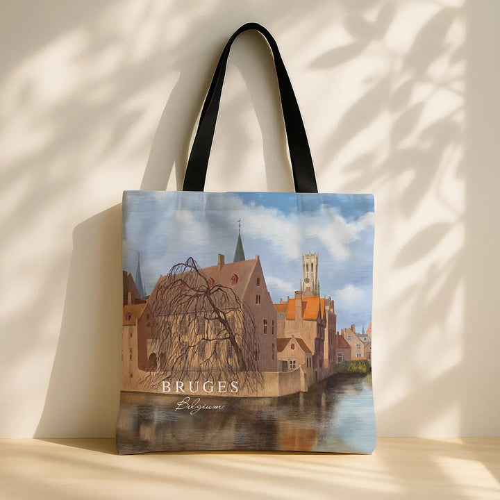 Tote bag with a scenic design of Bruges, featuring a watermill and buildings.